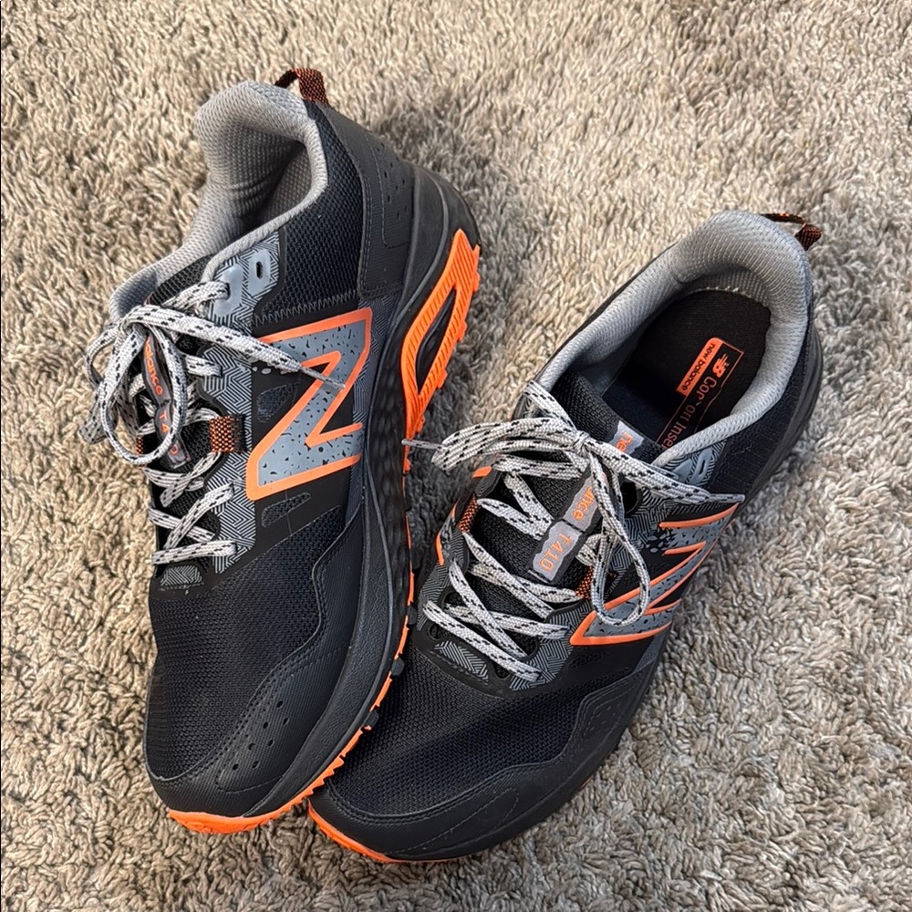 New Balance T410 Black and Orange Performance Sneakers